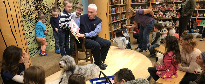 Dr. David C. Pate reading to children